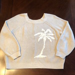 Tan knit sweater with palm tree embroidery